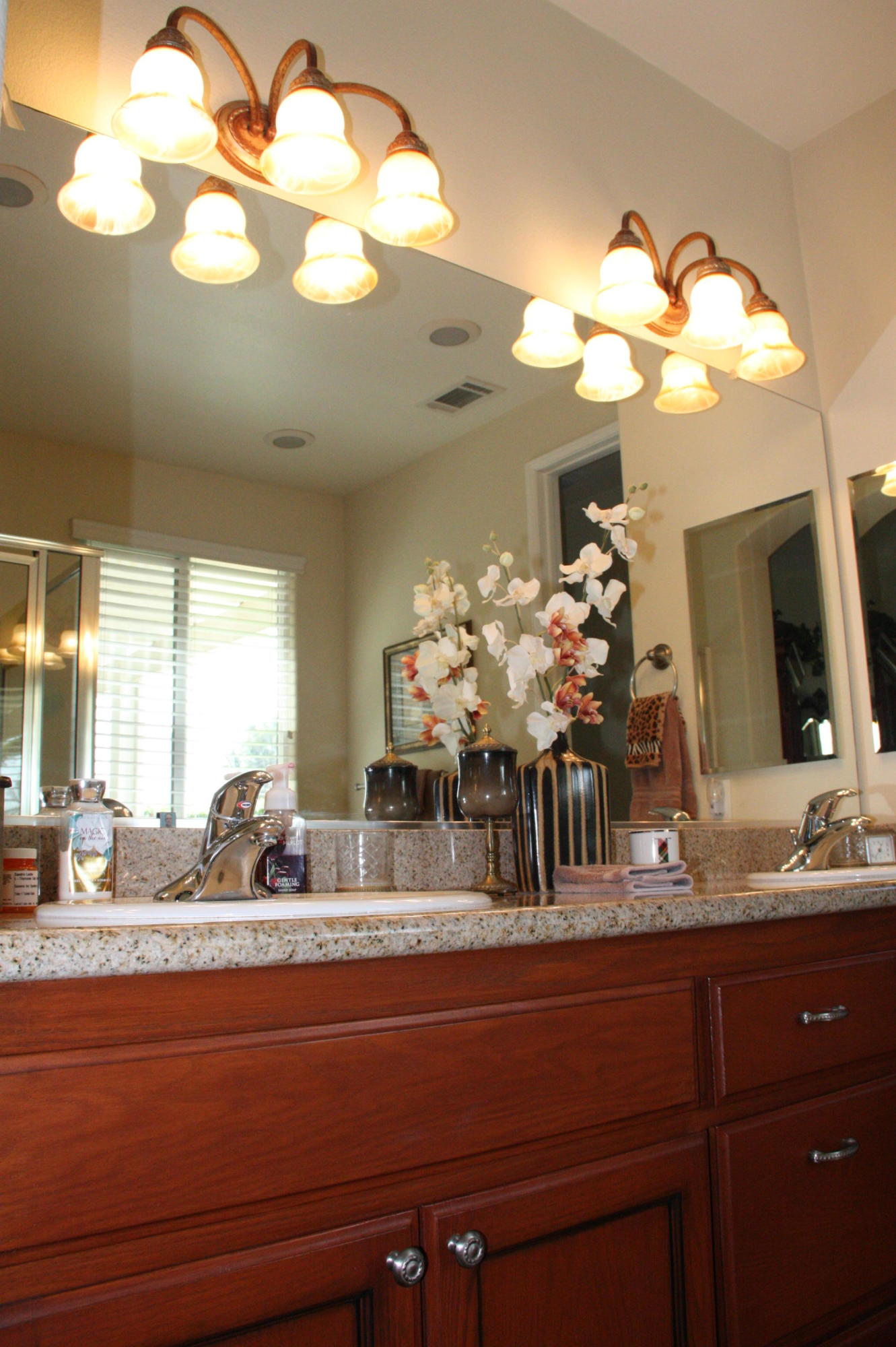 49758 Lewis Road Indio, CA 92201 - Photo 33 of 47 a bathroom with a granite countertop sink and a large mirror
