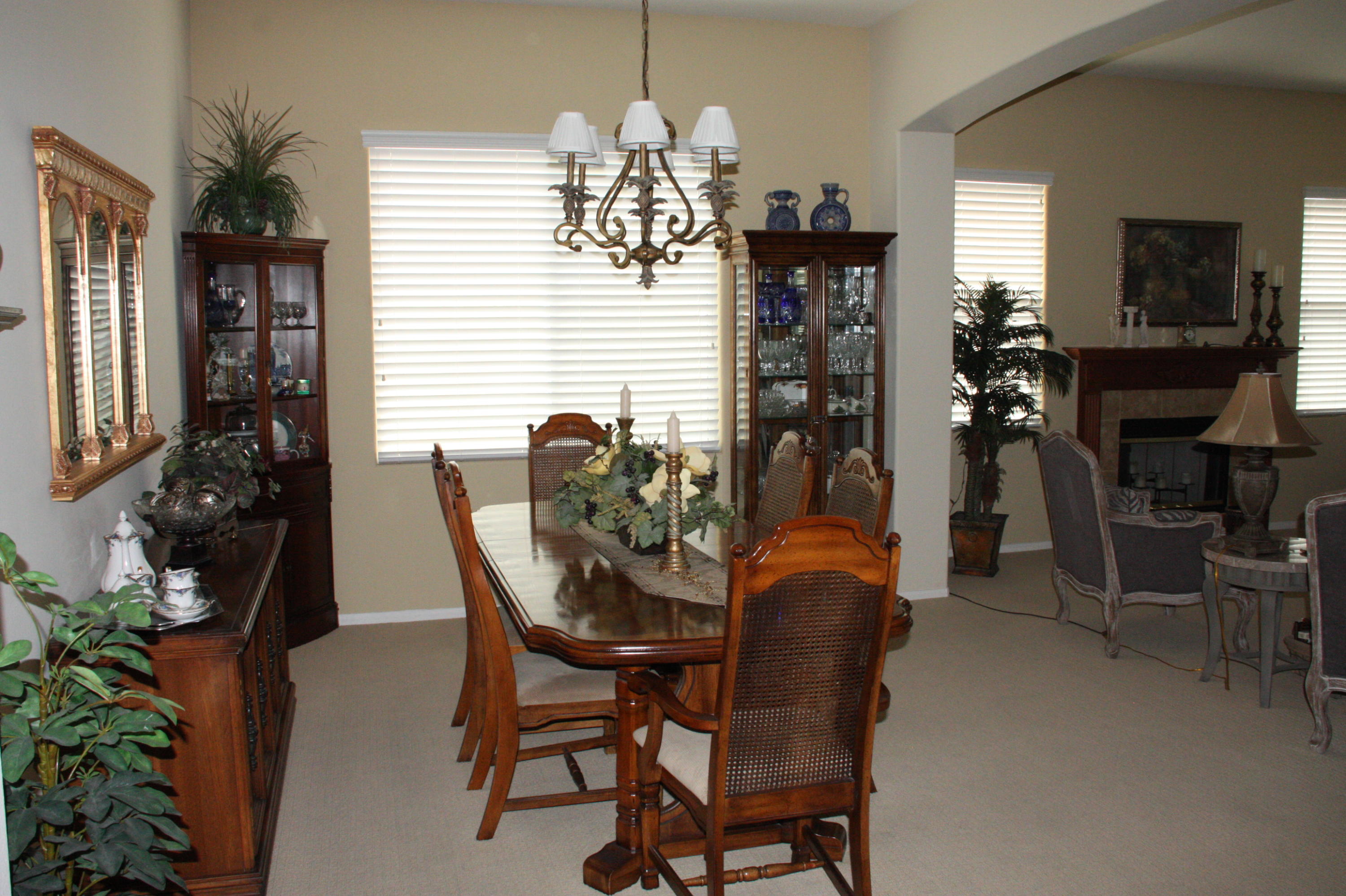 49758 Lewis Road Indio, CA 92201 - Photo 7 of 47 a dining room with furniture and chandelier