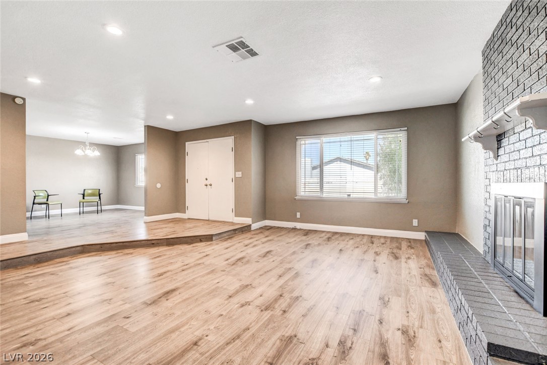 4367 South Mojave Road Las Vegas, NV 89121 - Photo 8 of 53 A split-level interior with a cozy fireplace and abundant natural light welcomes you inside.