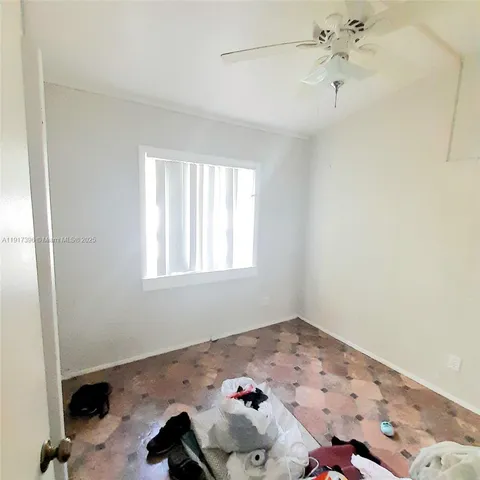 a bathroom with a sink and a window