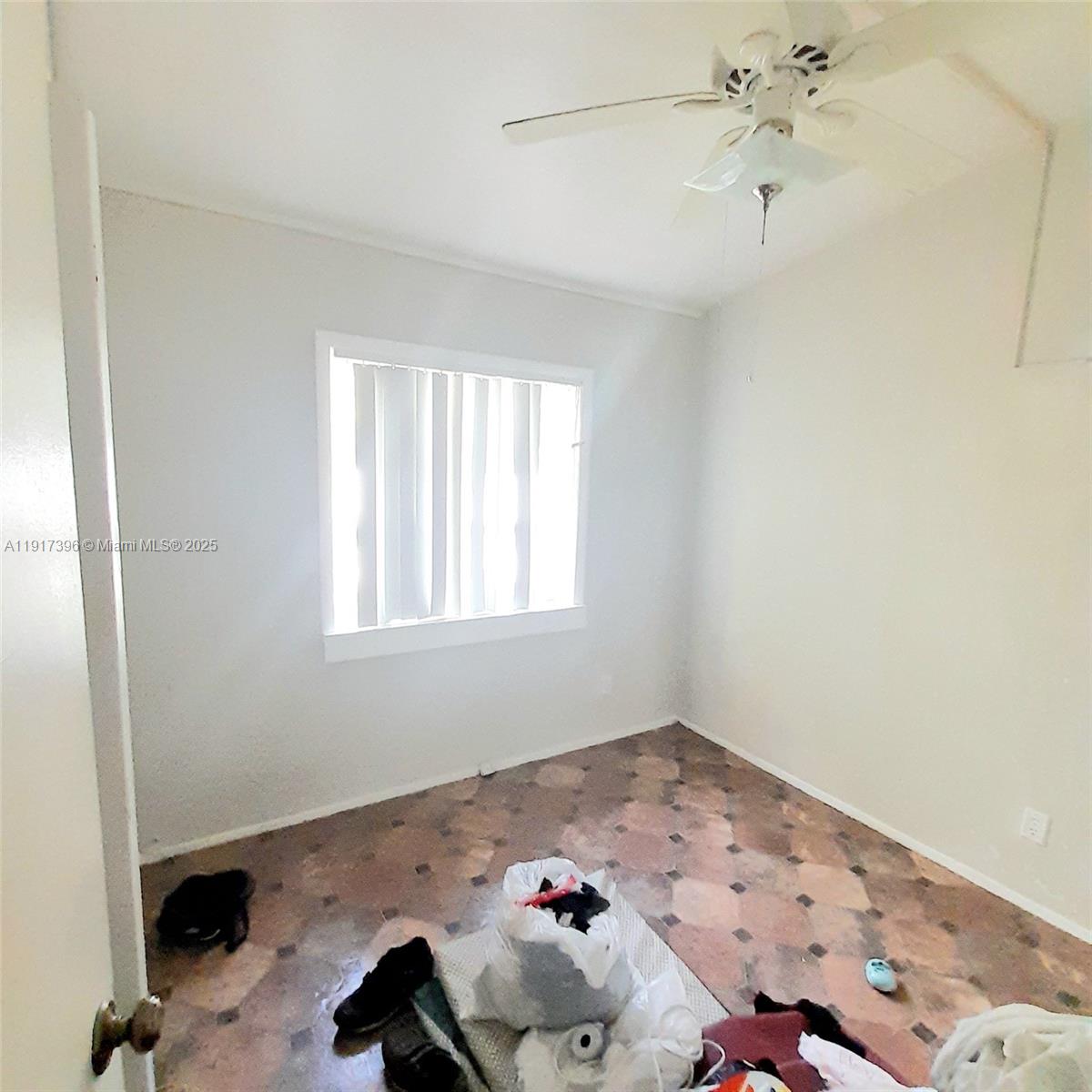 1830 Northeast 175th Street, Unit 1 North Miami Beach, FL 33162 - Photo 14 of 15 a bathroom with a sink and a window