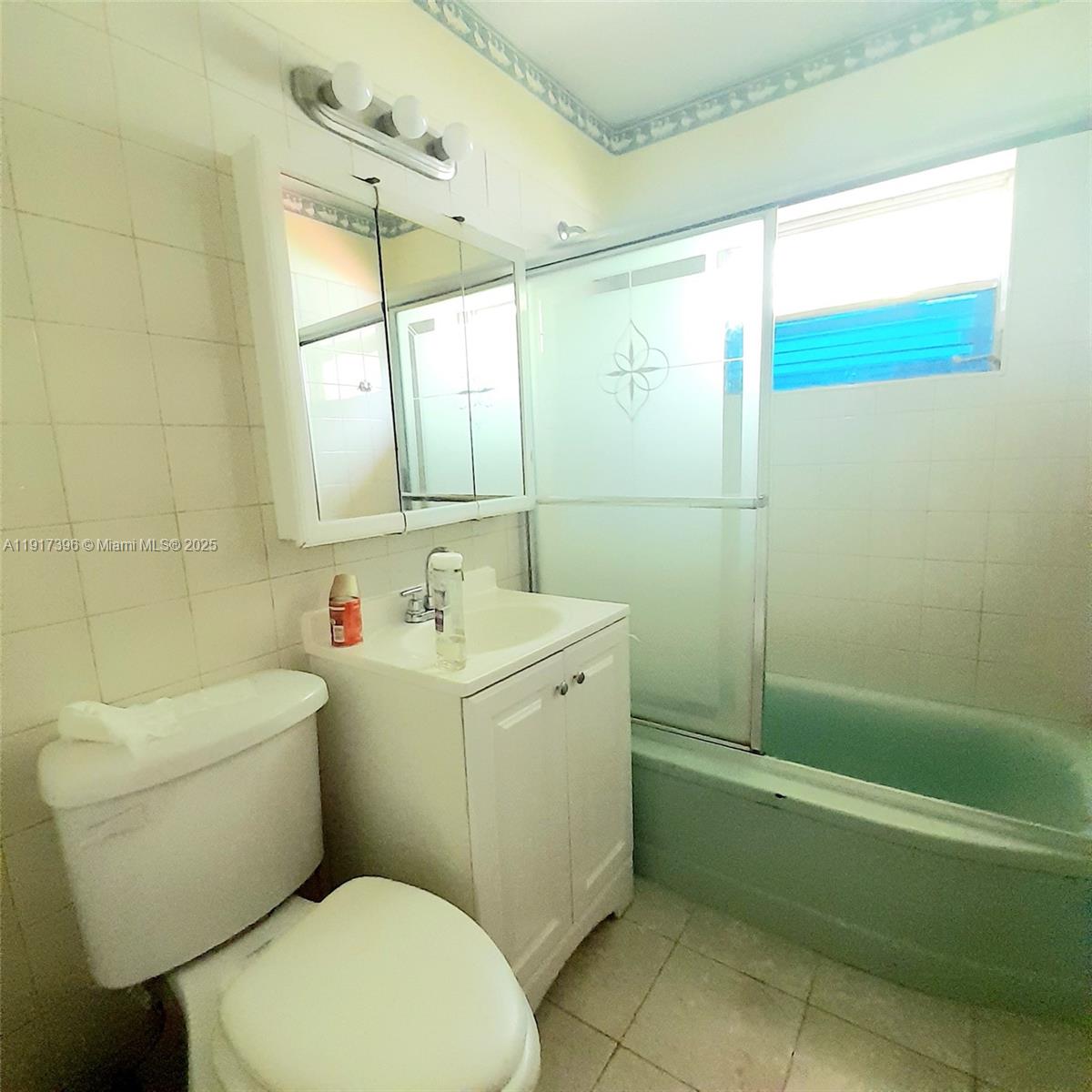 1830 Northeast 175th Street, Unit 1 North Miami Beach, FL 33162 - Photo 15 of 15 a bathroom with a sink a toilet and shower