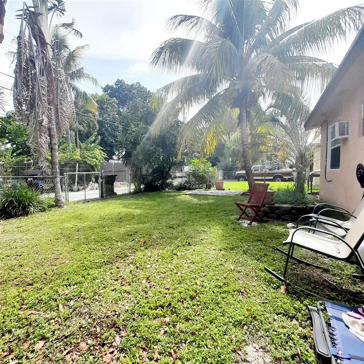 1830 Northeast 175th Street, Unit 1 North Miami Beach, FL 33162 - Photo 5 of 15 a view of a house with backyard