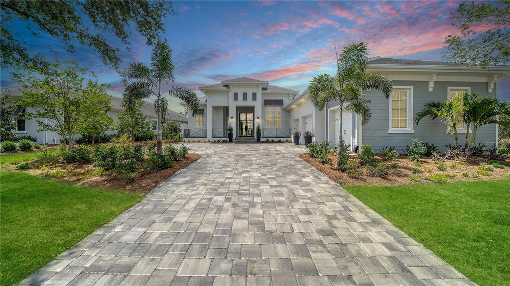 a front view of house with yard and green space
