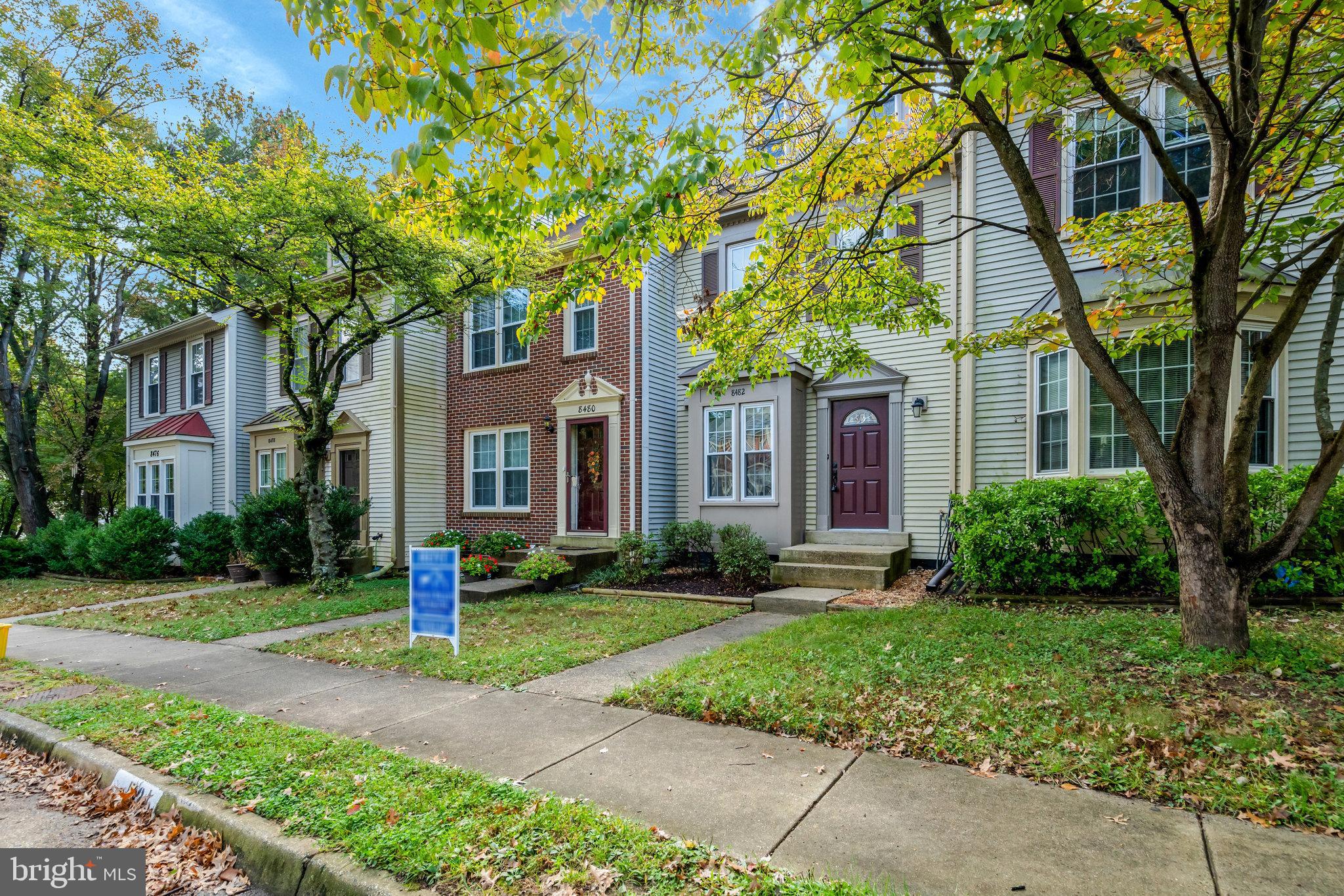 8482 Springfield Oaks Drive Springfield, VA 22153 - Photo 1 of 48 a front view of a house with a yard and tree