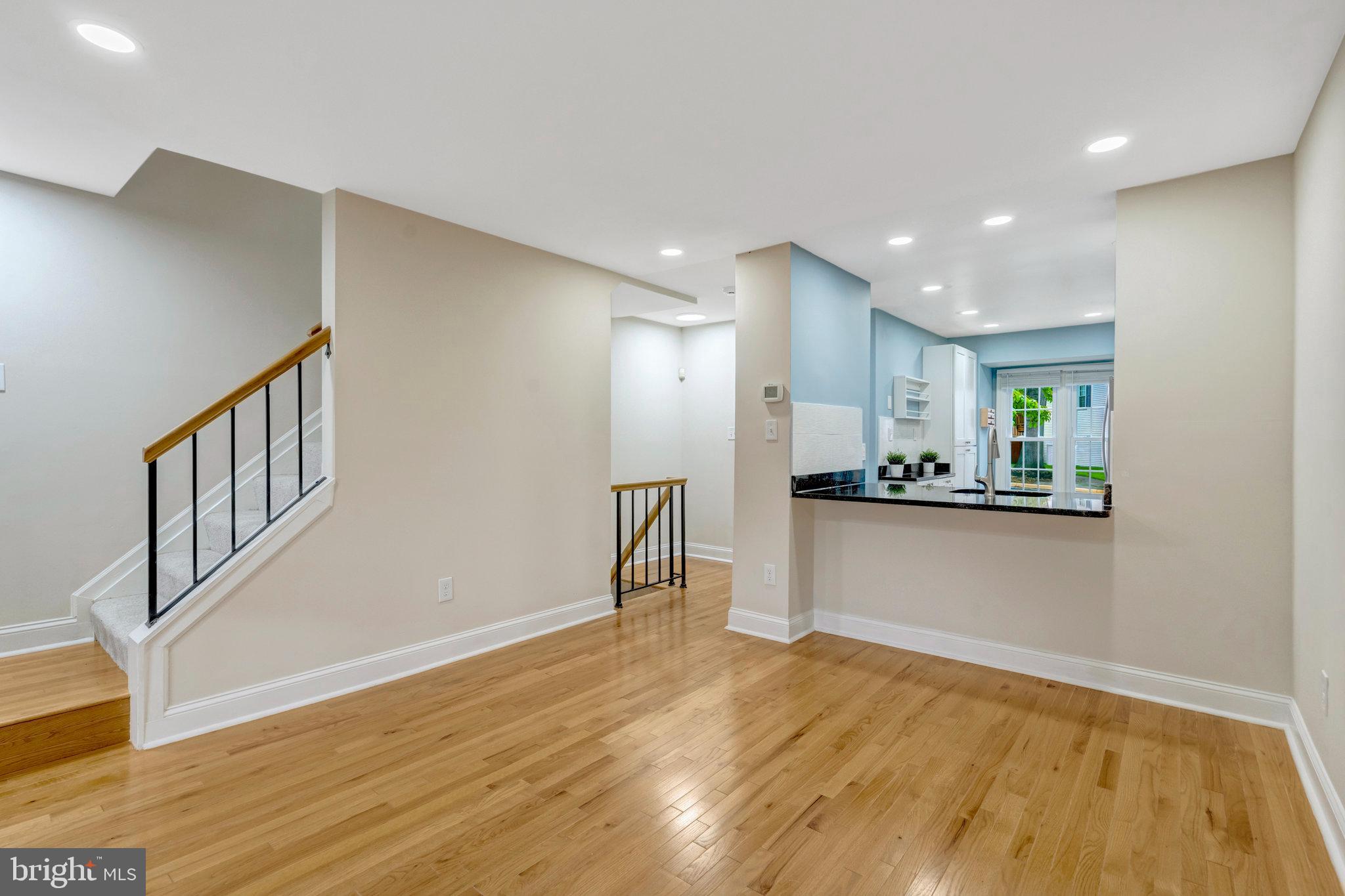 8482 Springfield Oaks Drive Springfield, VA 22153 - Photo 14 of 48 a view of a kitchen with a sink and a refrigerator