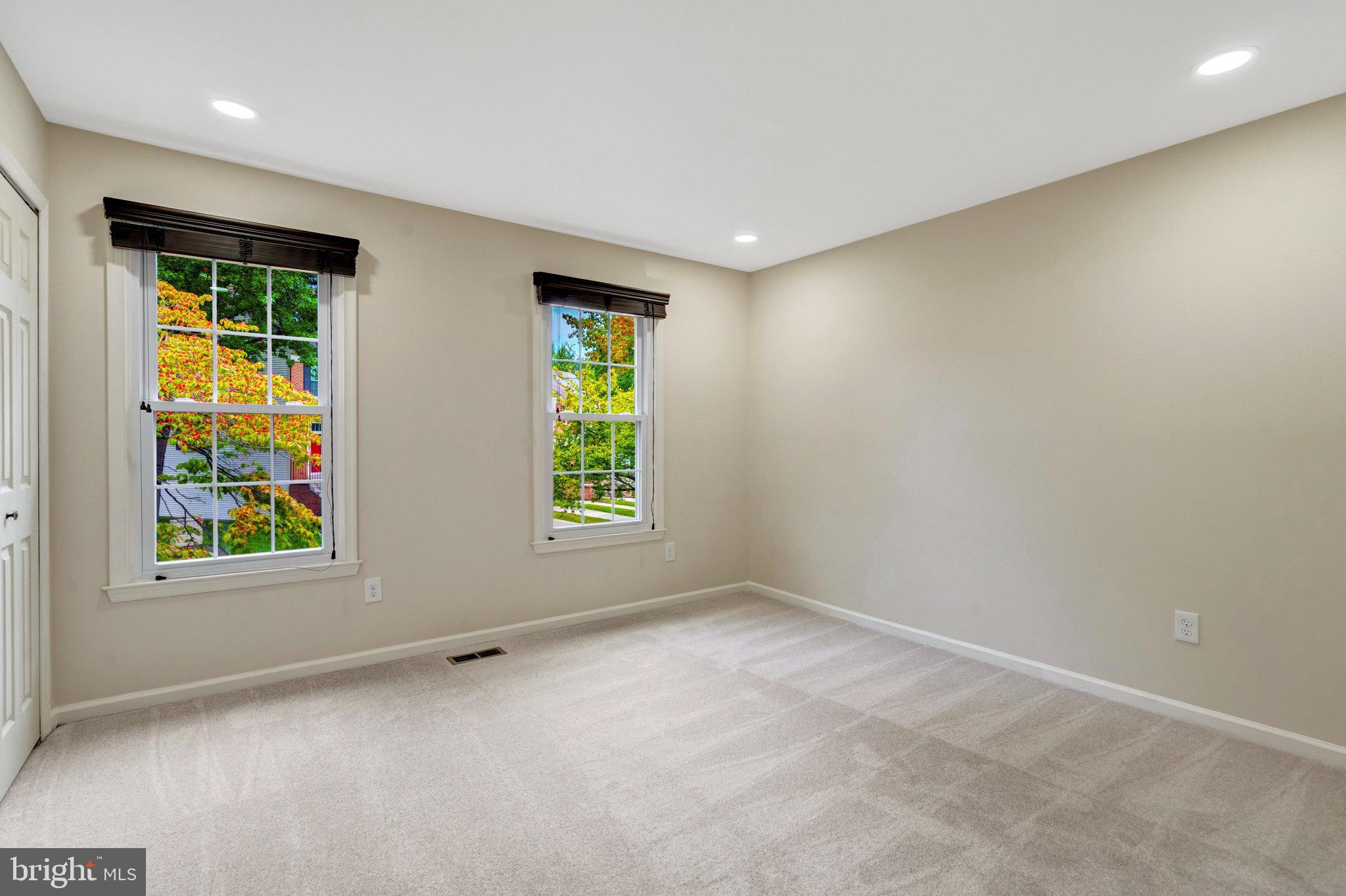 8482 Springfield Oaks Drive Springfield, VA 22153 - Photo 16 of 48 an empty room with windows