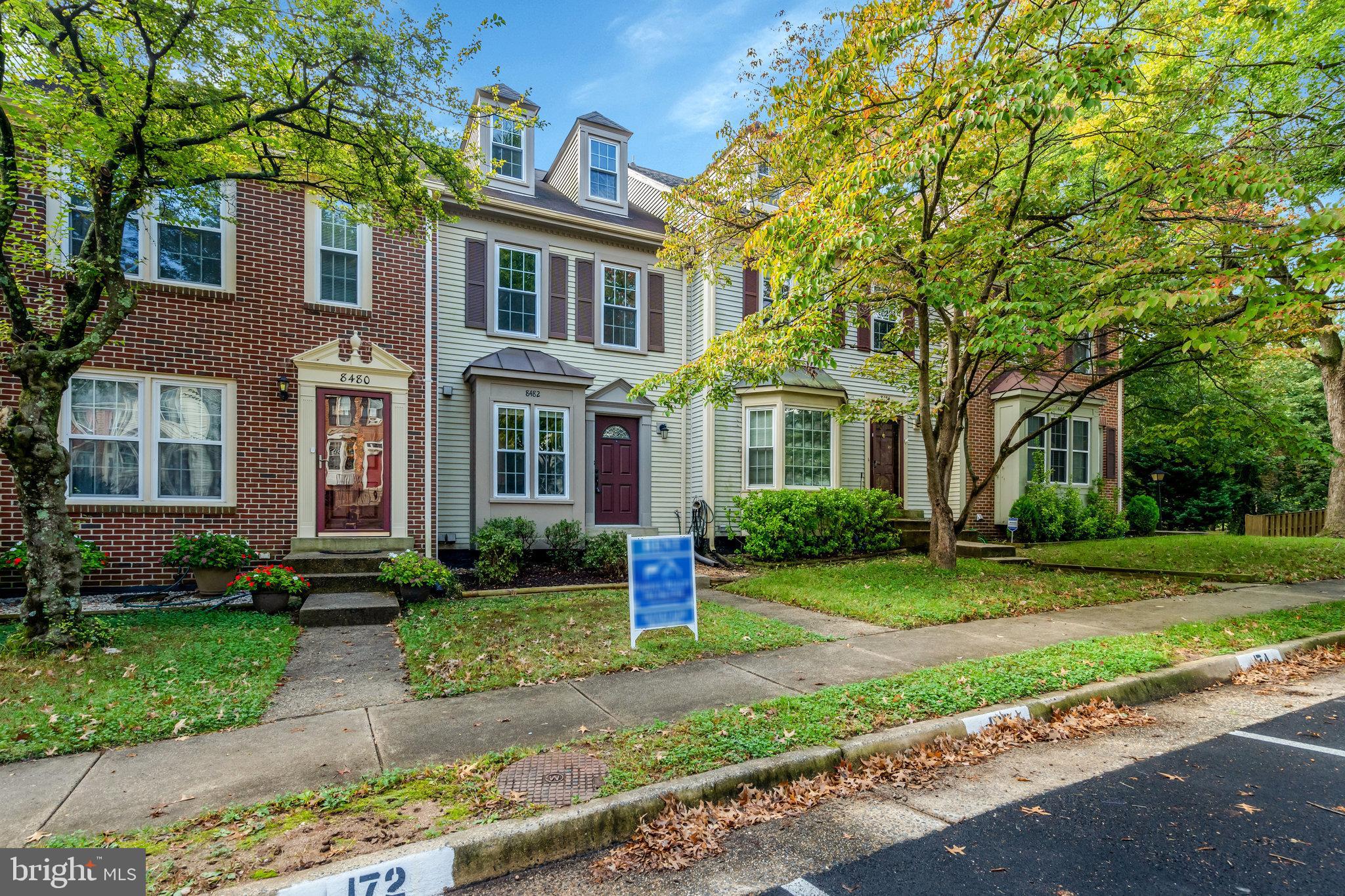 8482 Springfield Oaks Drive Springfield, VA 22153 - Photo 2 of 48 front view of a brick house with a yard