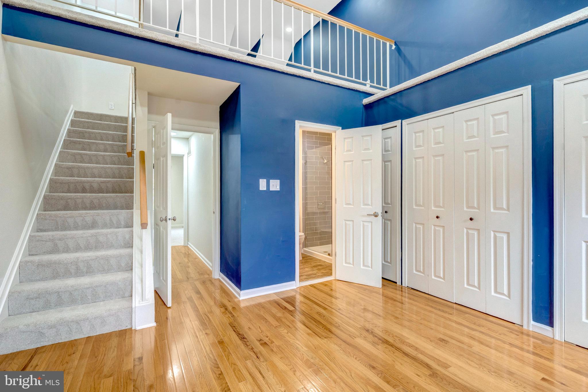8482 Springfield Oaks Drive Springfield, VA 22153 - Photo 24 of 48 a view of an entryway with wooden floor and door