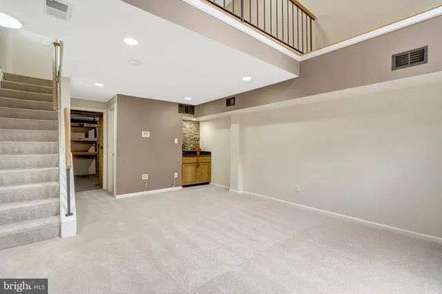 a view of an empty room with a fireplace
