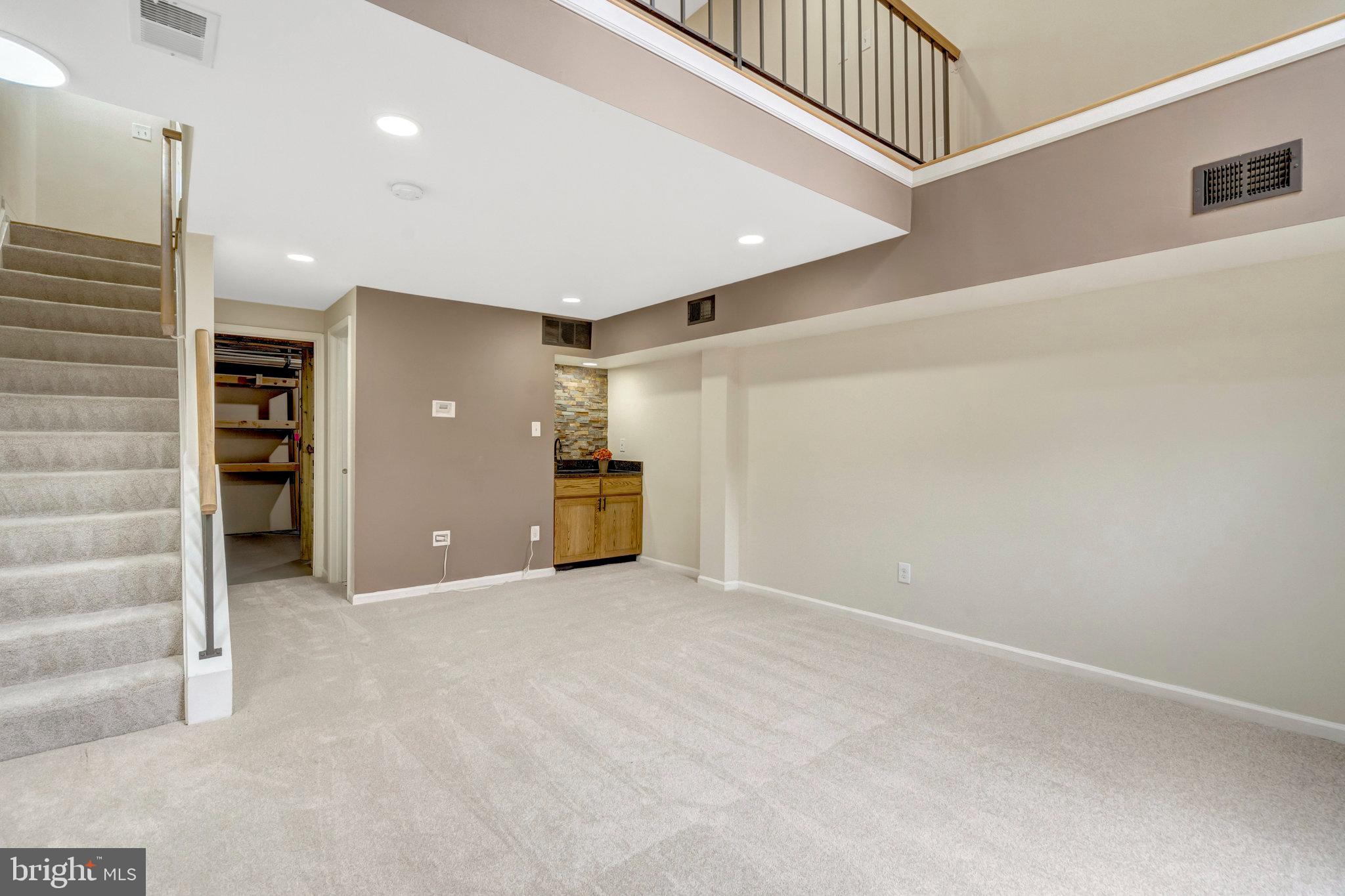 8482 Springfield Oaks Drive Springfield, VA 22153 - Photo 35 of 48 a view of an empty room with a fireplace