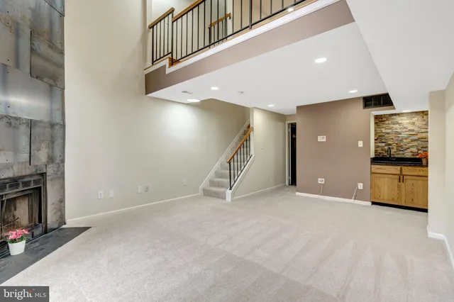 a view of an empty room with a fireplace