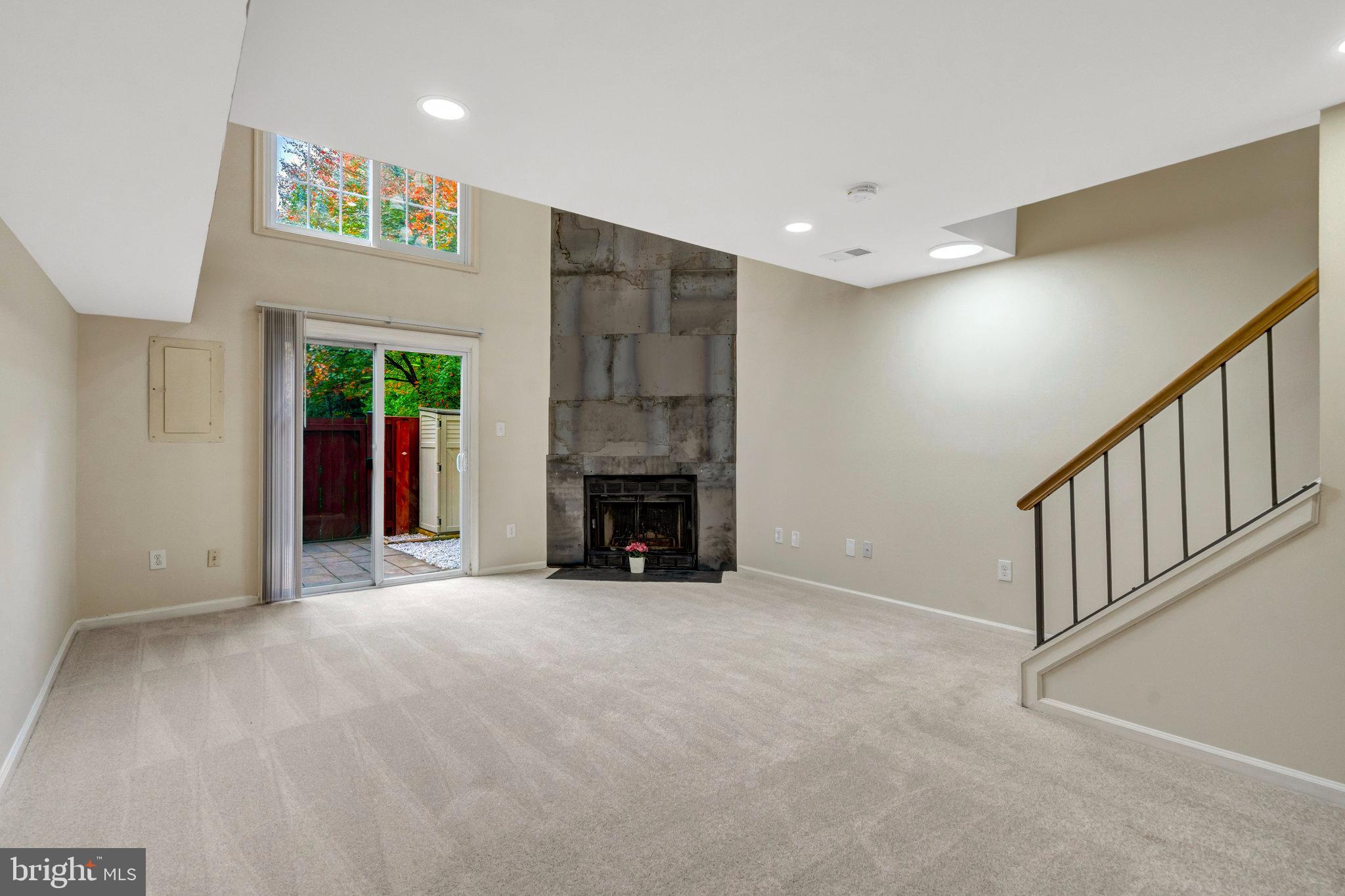 8482 Springfield Oaks Drive Springfield, VA 22153 - Photo 38 of 48 a view of an empty room with a fireplace