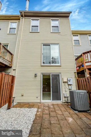 a view of a brick house with many windows
