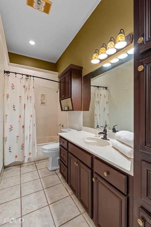 1962 Palmetto Road Benton, LA 71006 - Photo 22 of 40 Bathroom featuring a vanity with dark wood cabinetry and a light-colored countertop