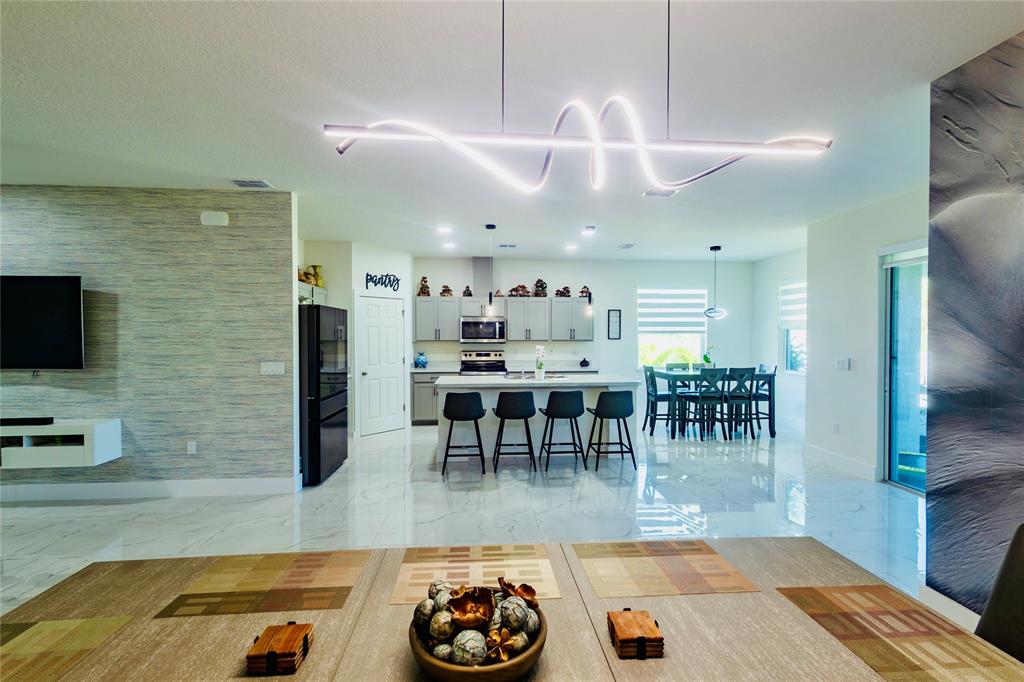 2149 Southwest Susset Lane Port St. Lucie, FL 34953 - Photo 24 of 47 a view of a dining room with furniture