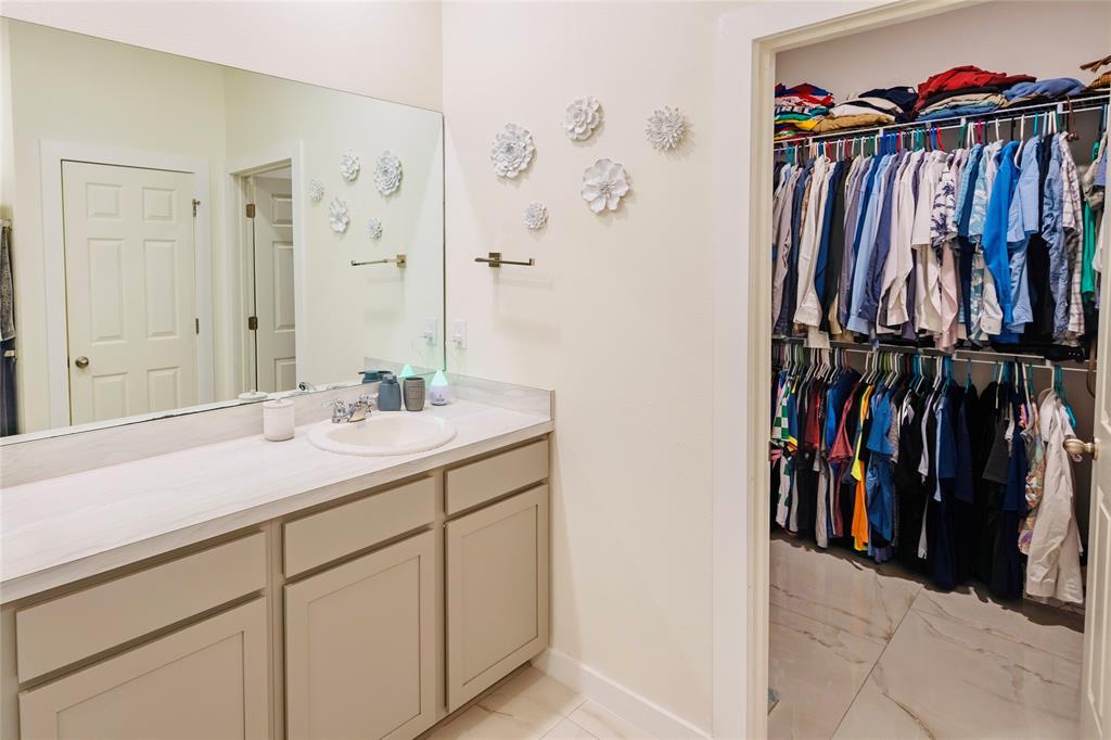 2149 Southwest Susset Lane Port St. Lucie, FL 34953 - Photo 33 of 47 a view of walk in closet with clothes