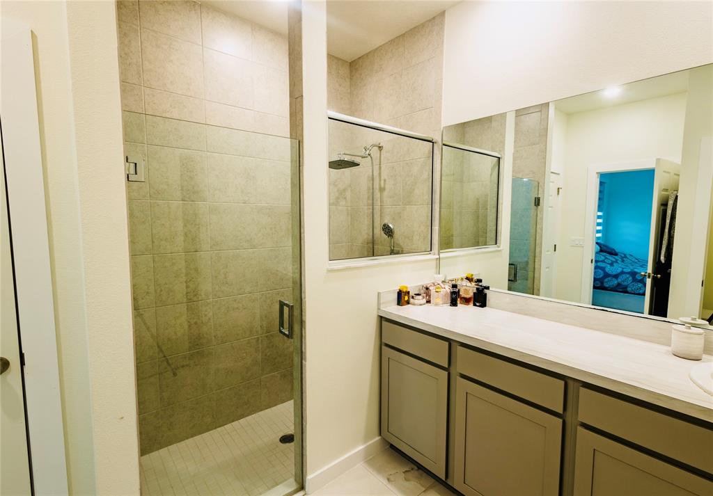 2149 Southwest Susset Lane Port St. Lucie, FL 34953 - Photo 34 of 47 a bathroom with a double vanity sink and mirror