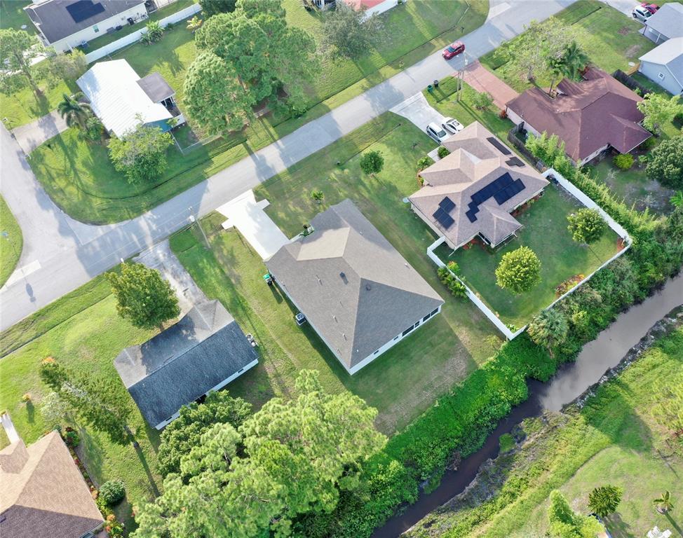 2149 Southwest Susset Lane Port St. Lucie, FL 34953 - Photo 43 of 47 an aerial view of a house with garden