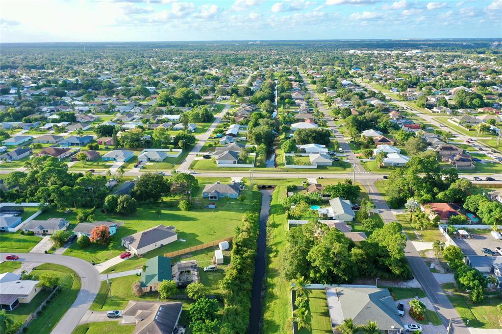 2149 Southwest Susset Lane Port St. Lucie, FL 34953 - Photo 46 of 47 an aerial view of a city with lots of residential buildings