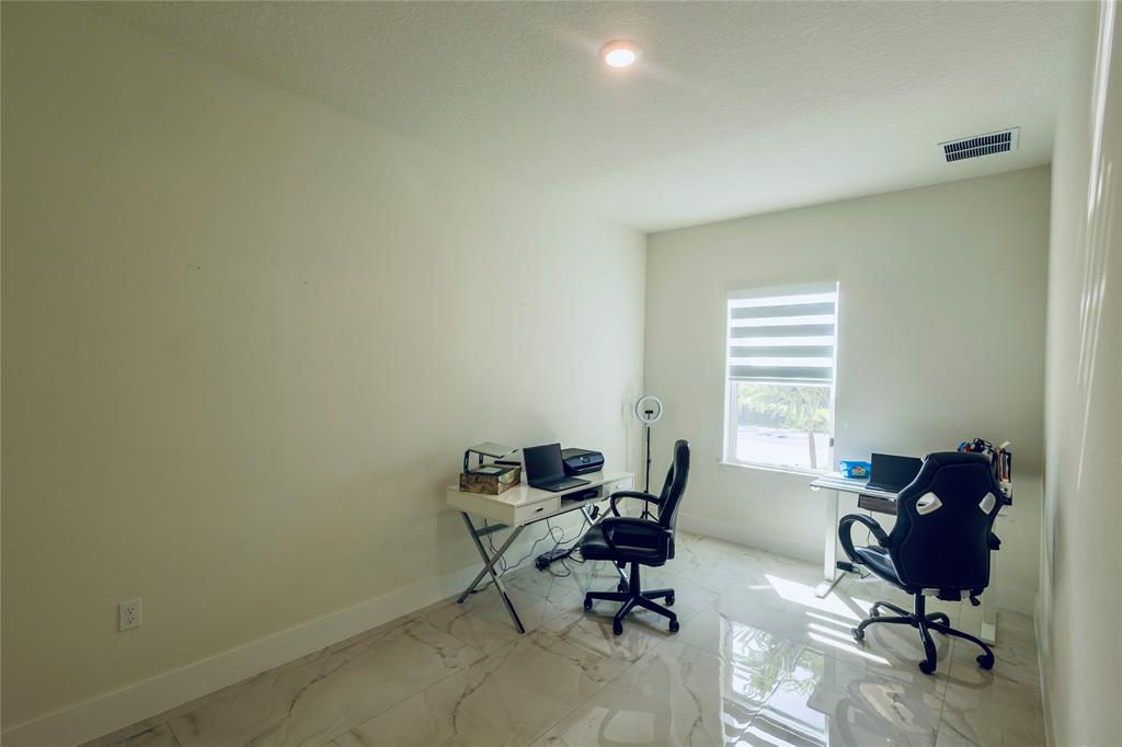 2149 Southwest Susset Lane Port St. Lucie, FL 34953 - Photo 7 of 47 a view of a workspace with a window