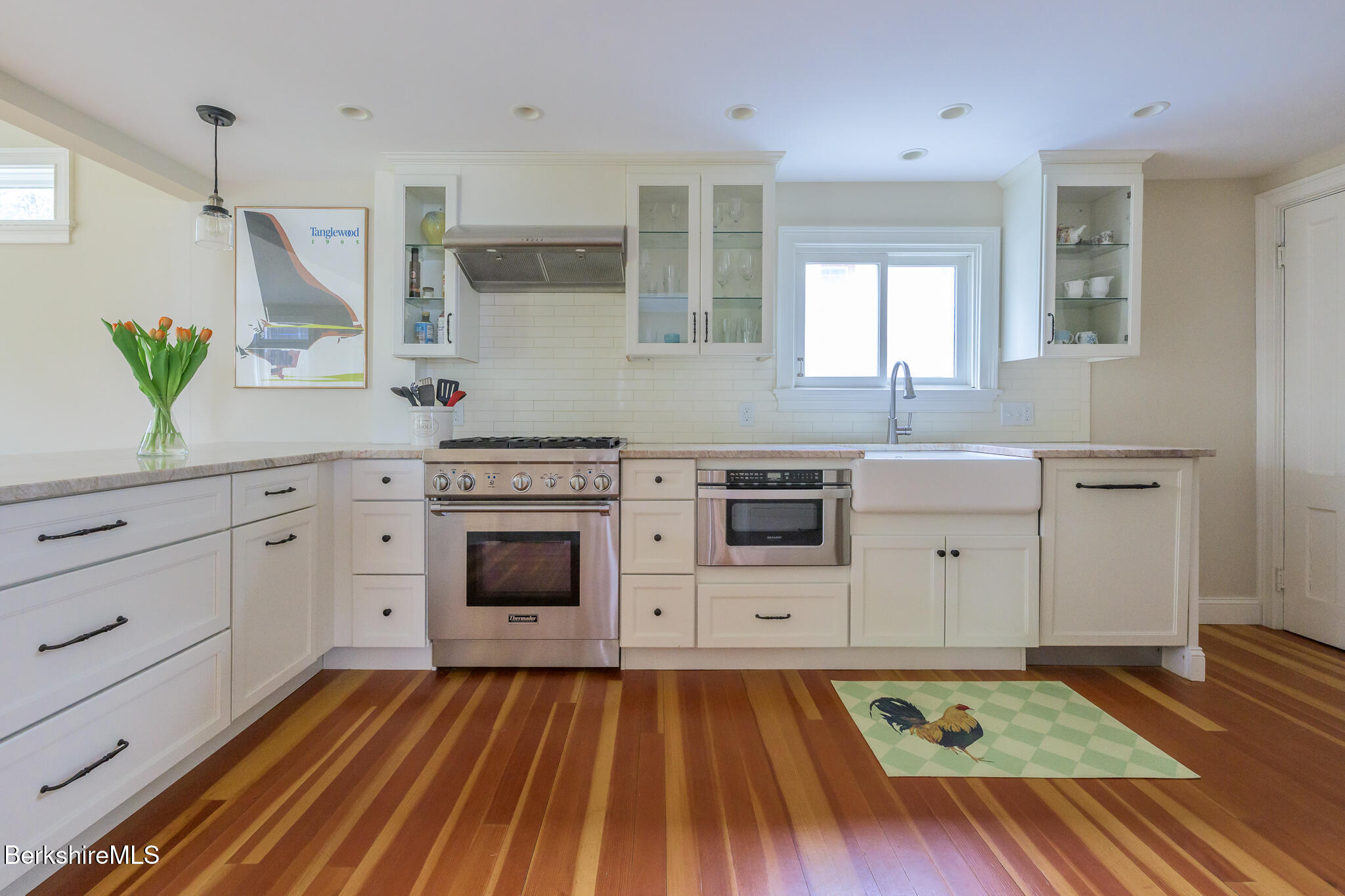 11 Sergeant Street Stockbridge, MA 01262 - Photo 9 of 52 a kitchen with stainless steel appliances a stove sink and cabinets