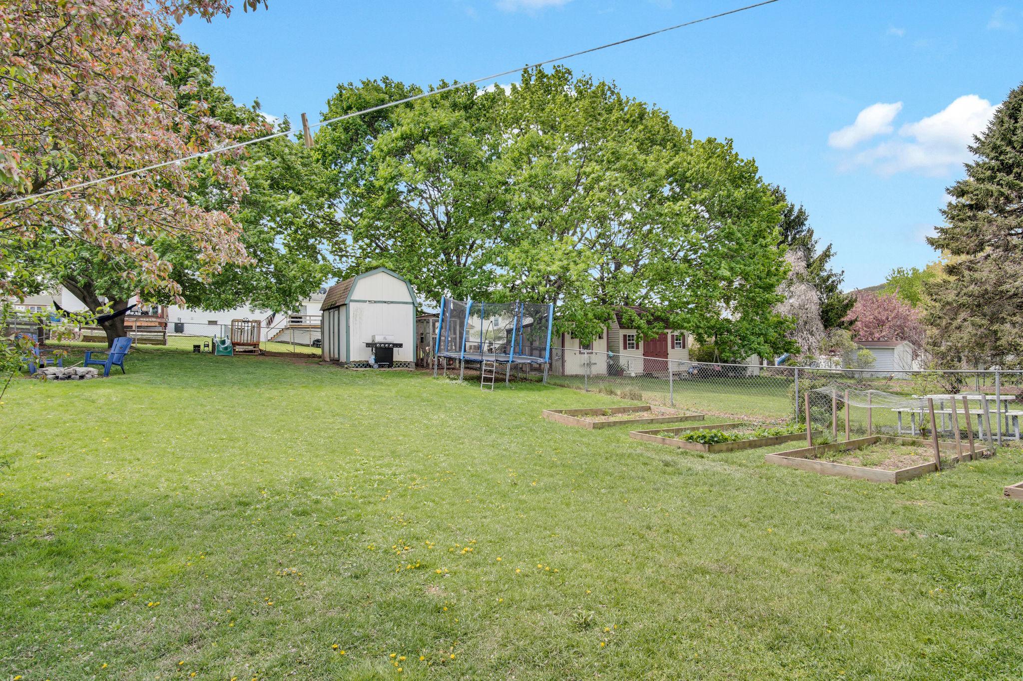 12 Furman Road Dillsburg, PA 17019 - Photo 30 of 33 Spacious backyard with lush greenery.