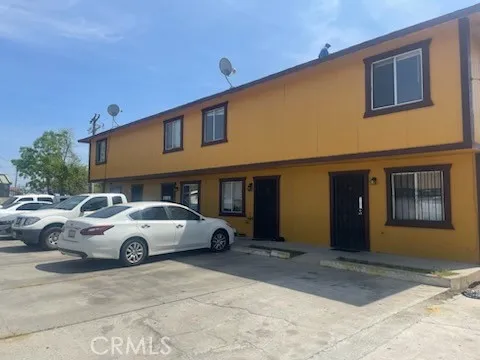 a front view of a house with parking space