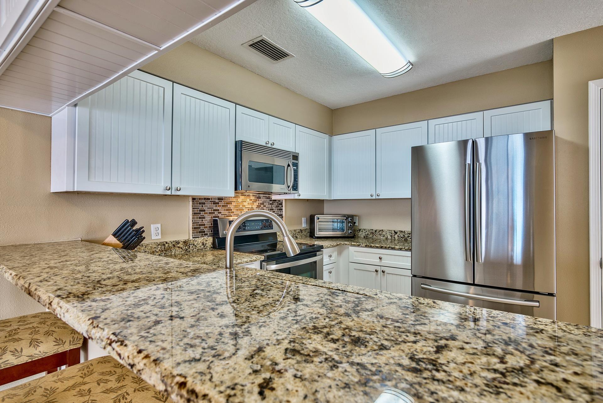 28 Moreno Point Road, Unit E Destin, FL 32541 - Photo 2 of 54 Breakfast bar looking into kitchen