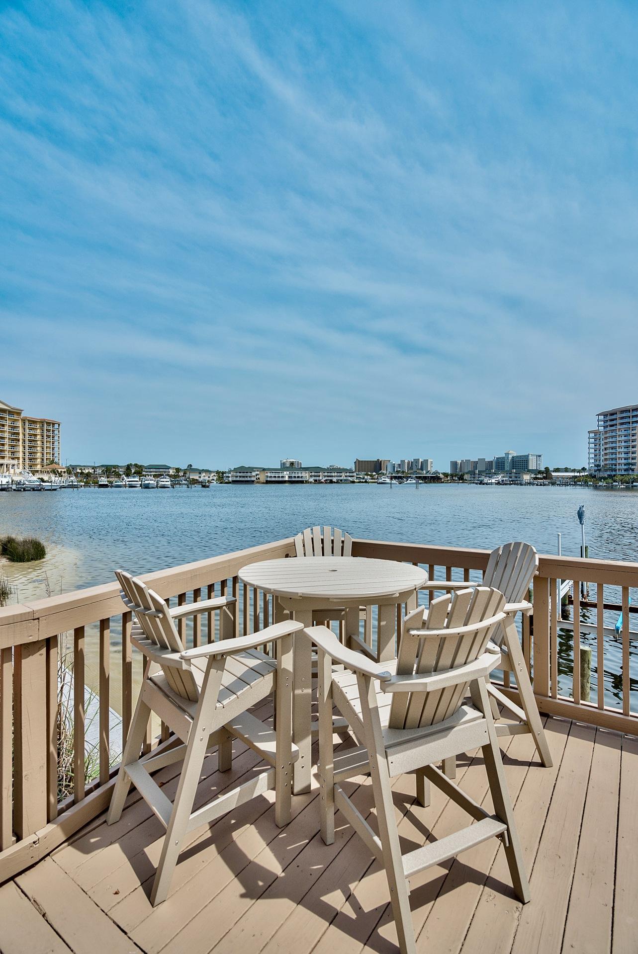 28 Moreno Point Road, Unit E Destin, FL 32541 - Photo 47 of 54 Community table and chairs on deck