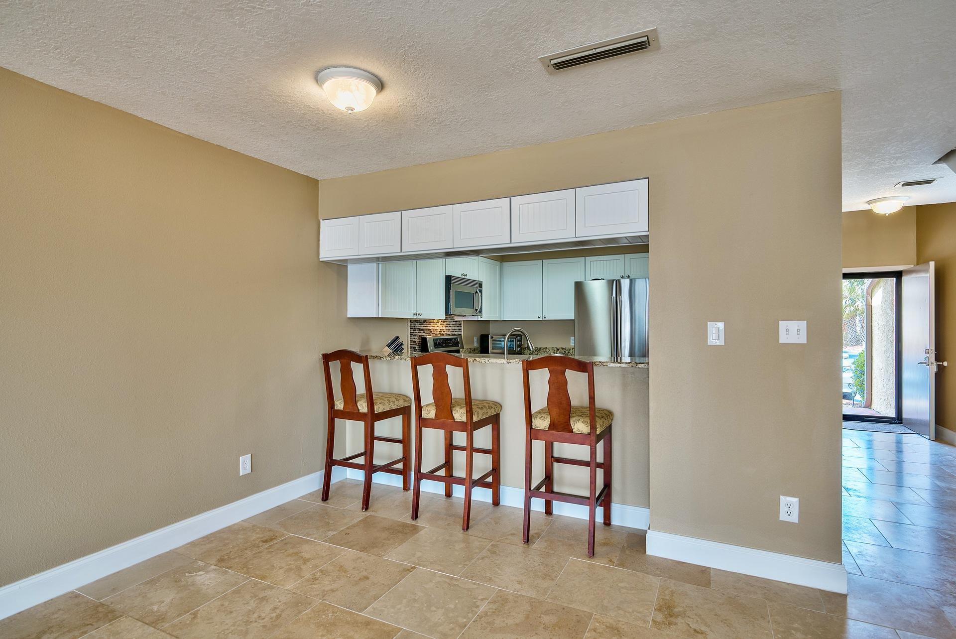 28 Moreno Point Road, Unit E Destin, FL 32541 - Photo 8 of 54 Dining area and breakfast bar
