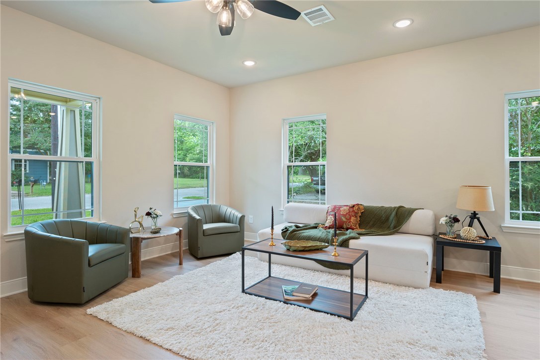 804 East 27th Street Bryan, TX 77803 - Photo 4 of 21 a living room with furniture and a large window