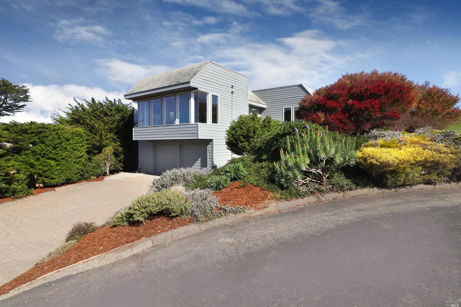 20920 Grebe Court Bodega Bay, CA 94923 - Photo 1 of 1 a view of a house with a small yard and a large tree