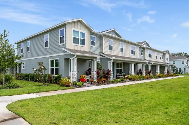 a front view of a house with a yard table and chairs