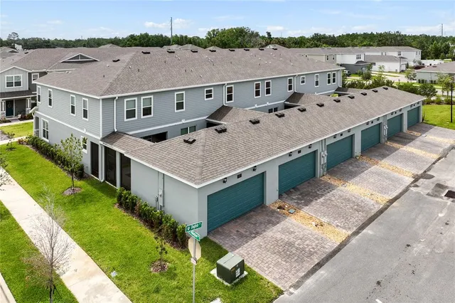an aerial view of a house with a garden