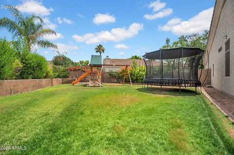 a view of a backyard of the house