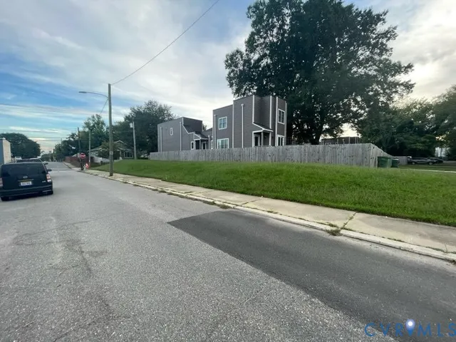 a view of street with parked cars