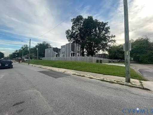 a view of street with parked cars