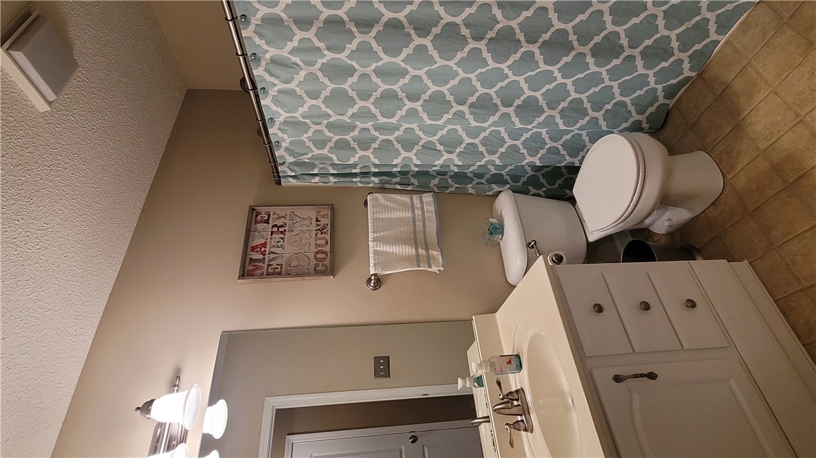 325 McAdams School Road Honea Path, SC 29654 - Photo 19 of 22 Functional primary bath featuring a vanity with sink and tile flooring, offering practical comfort.
