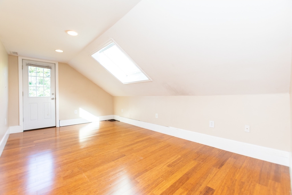 27 Shannon Street, Unit 2L Boston, MA 02135 - Photo 13 of 22 a view of empty room with wooden floor and fan