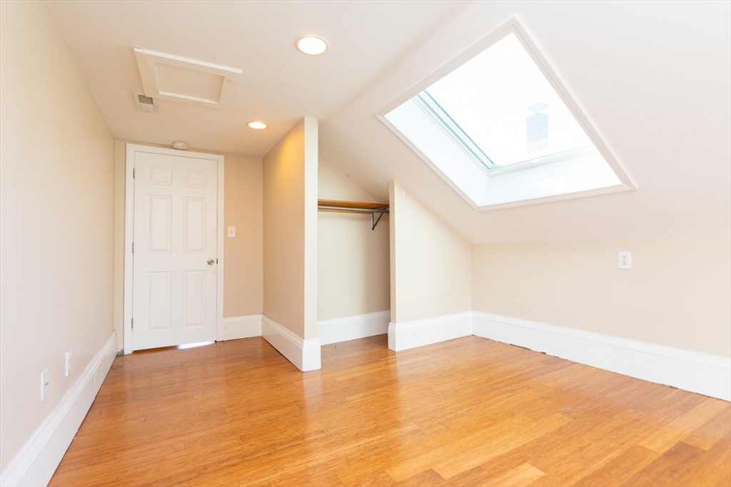 27 Shannon Street, Unit 2L Boston, MA 02135 - Photo 16 of 22 a view of empty room with wooden floor