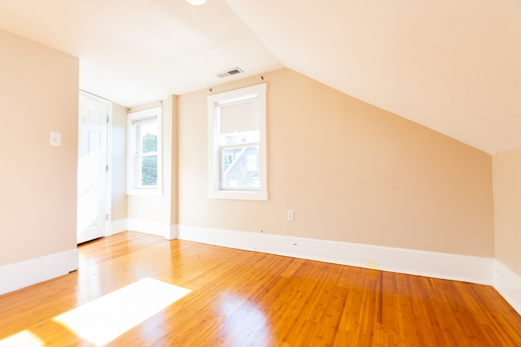 27 Shannon Street, Unit 2L Boston, MA 02135 - Photo 10 of 22 a view of empty room with wooden floor