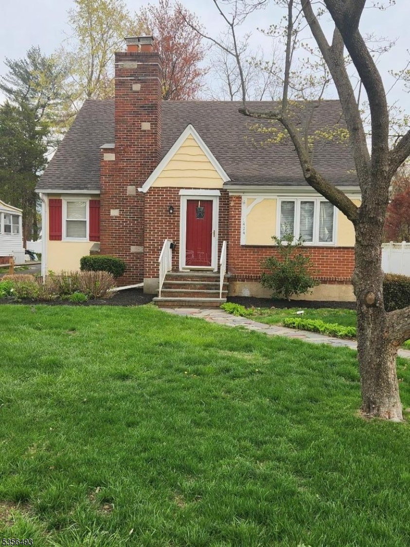 1424 East Front Street, Unit 2 Plainfield, NJ 07062 - Photo 1 of 6 a front view of a house with garden