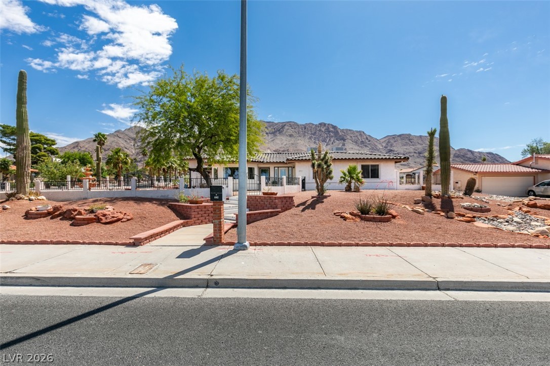 892 North Hollywood Boulevard Las Vegas, NV 89110 - Photo 66 of 81 This desert dwelling offers captivating mountain views and a welcoming front entrance.