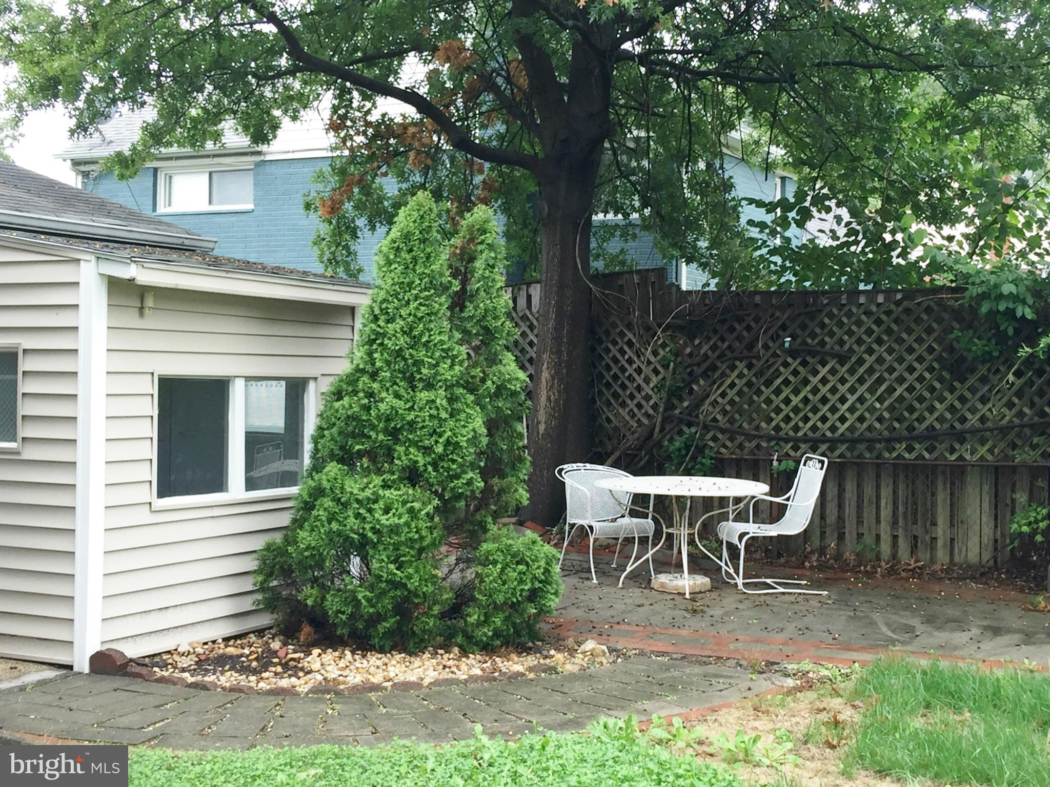 6824 Highland Street Springfield, VA 22150 - Photo 22 of 27 a view of a wooden bench in the backyard of a house