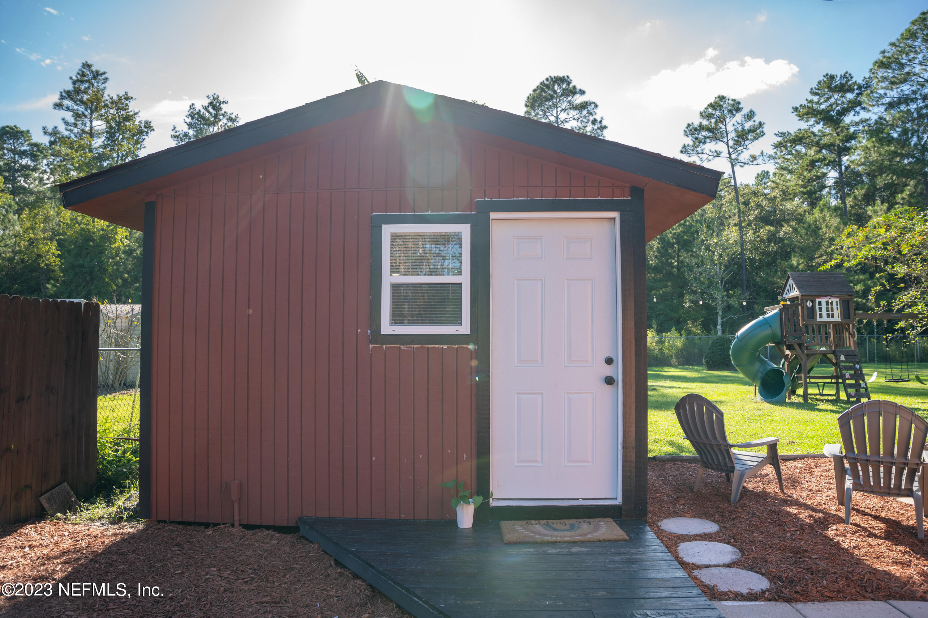 9008 Old Kings Road Jacksonville, FL 32219 - Photo 20 of 22 a backyard of a house with outdoor seating