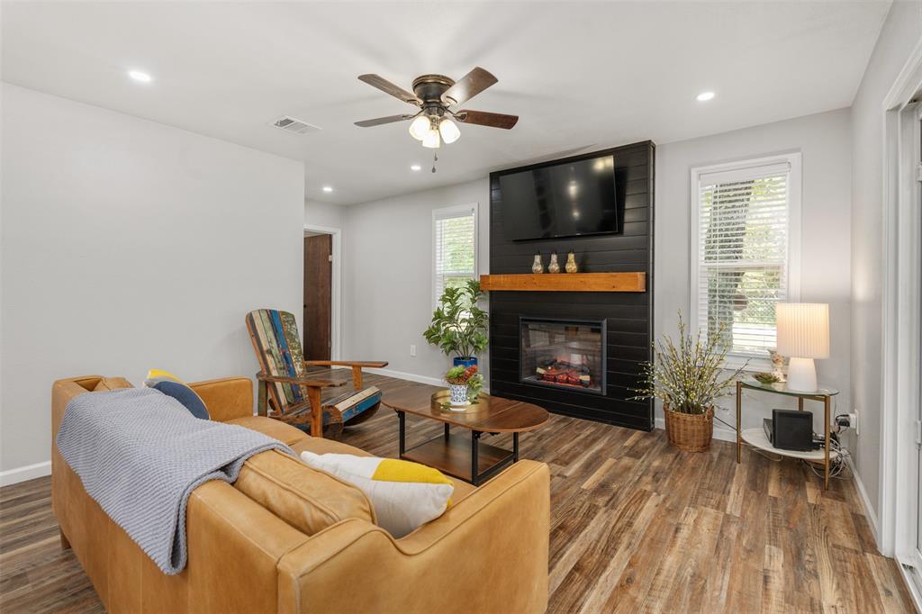 709 Westwind Road Tool, TX 75143 - Photo 1 of 1 Living room with a wealth of natural light, a large fireplace