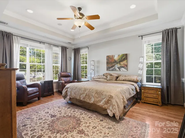 a bedroom with a bed and a flat screen television