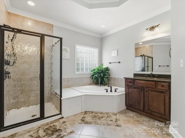 a spacious bathroom with a sink and a mirror