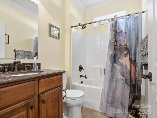 a bed room with a bed and a chair